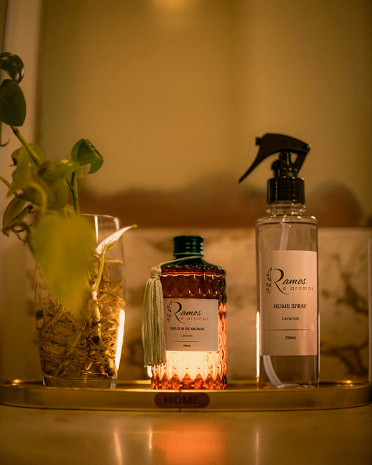 Three bottles and a plant on a tray